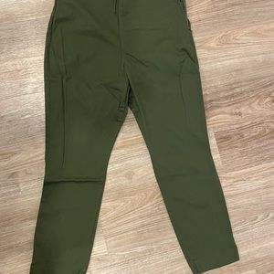 Green, ankle length, stretchy material, zipper on the side, fake back pockets